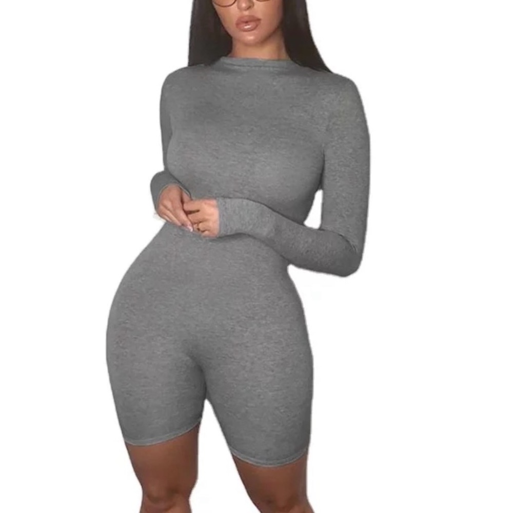 Women’s gray jumpsuit , long sleeve - short bottoms .